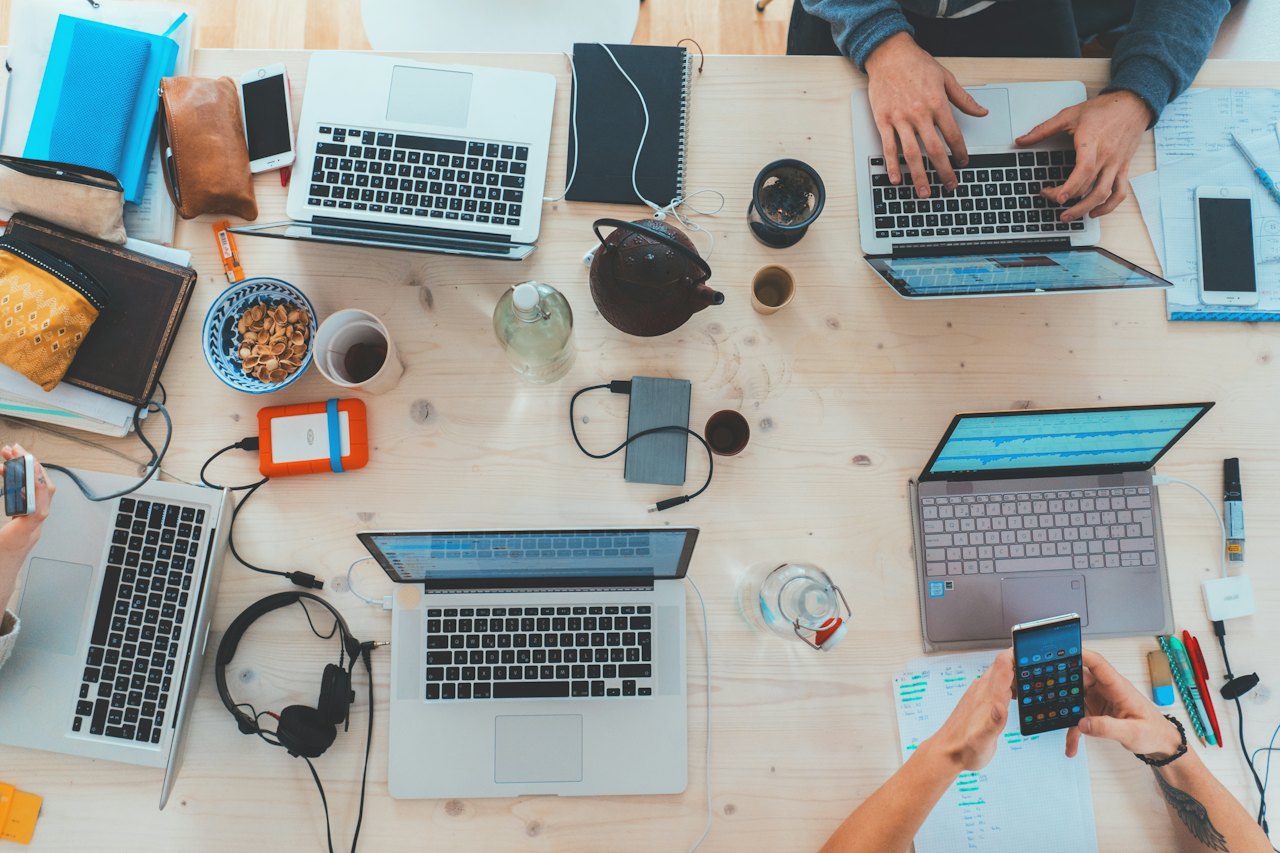 Review desk with technical documents, laptops and test equipment